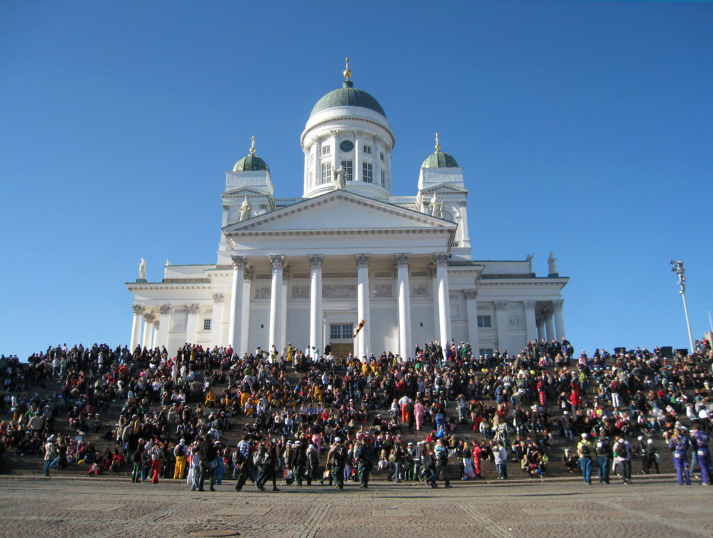 Hundreds of university students celebrating May 1st on the stairs of Helsinki Cathedral.